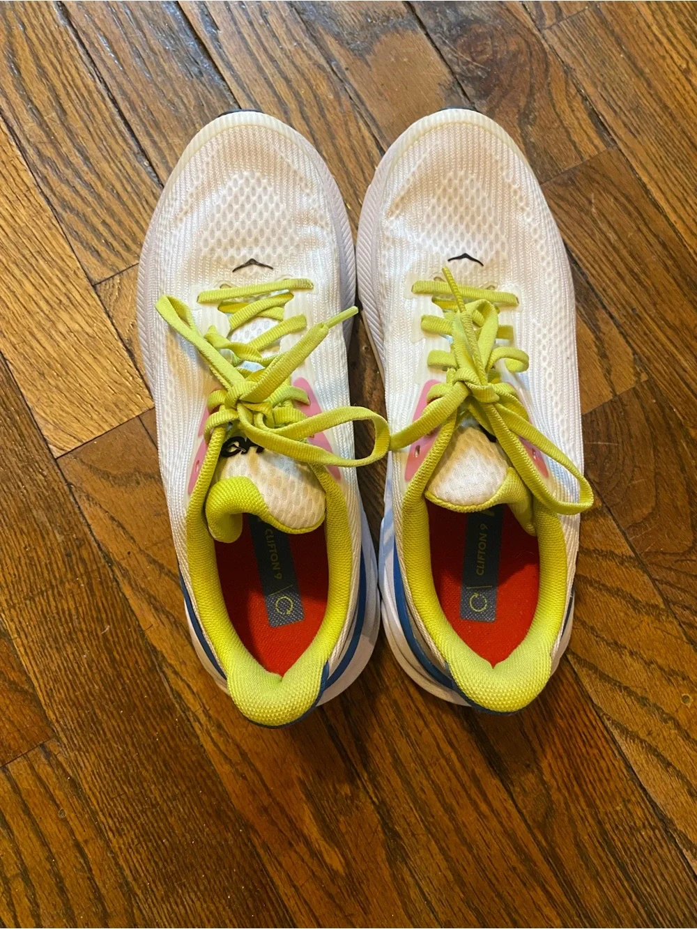 Hoka White Athletic Shoes with Blue Gradient and Neon Yellow Laces